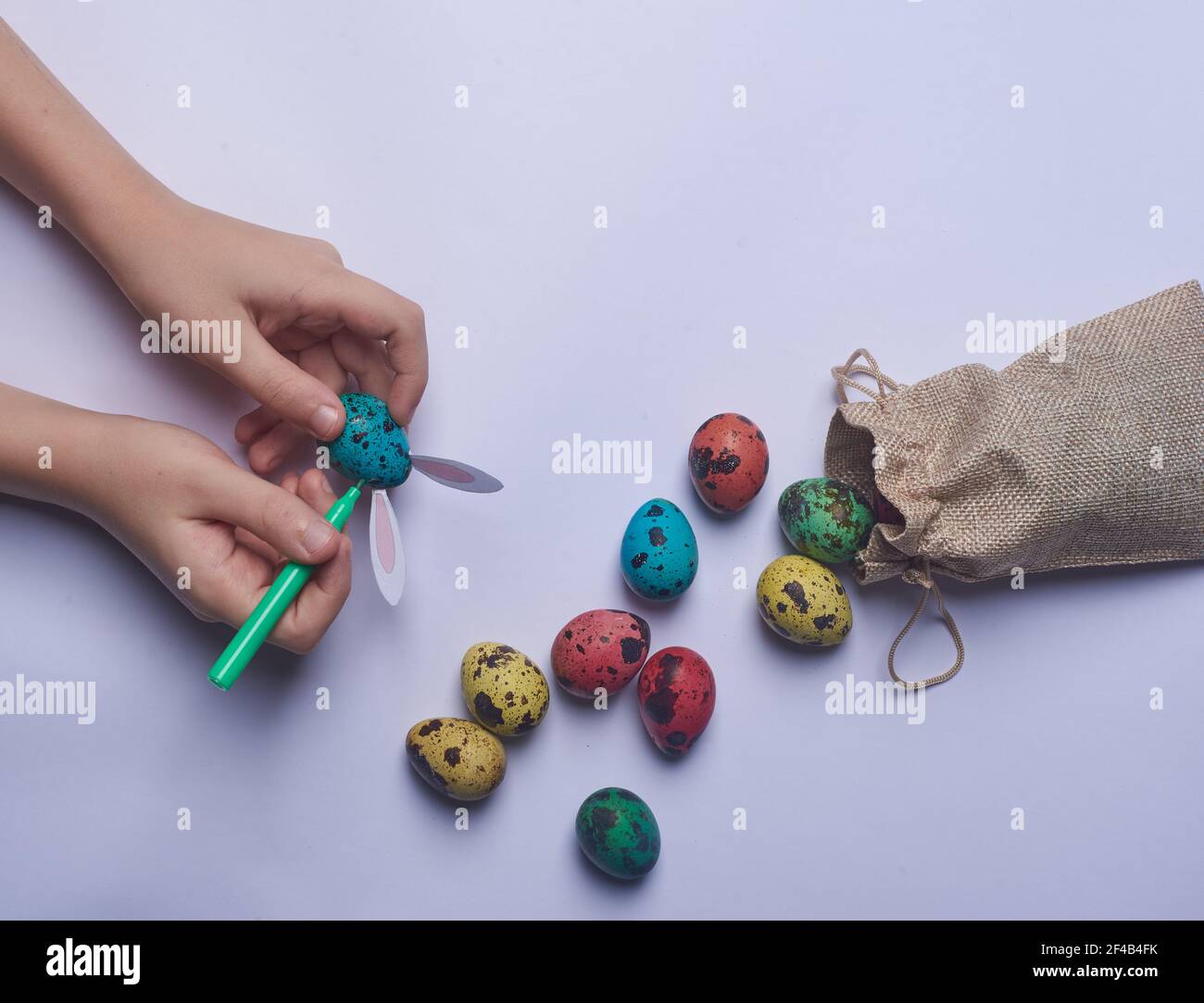 egg with ears and a bag of Easter eggs Stock Photo