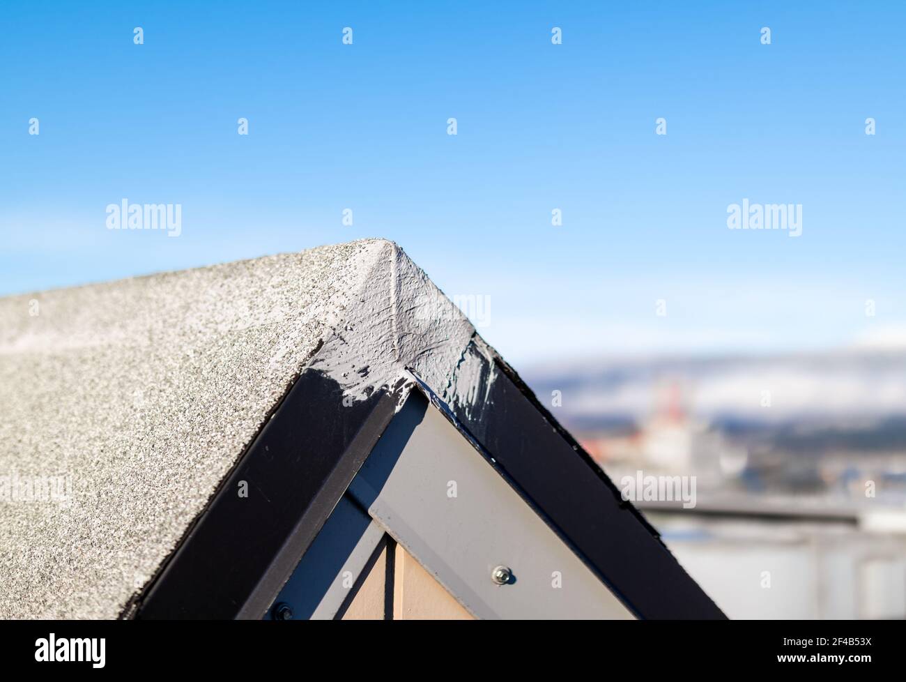 Skylight with repair work on metal flashing corner and defocused