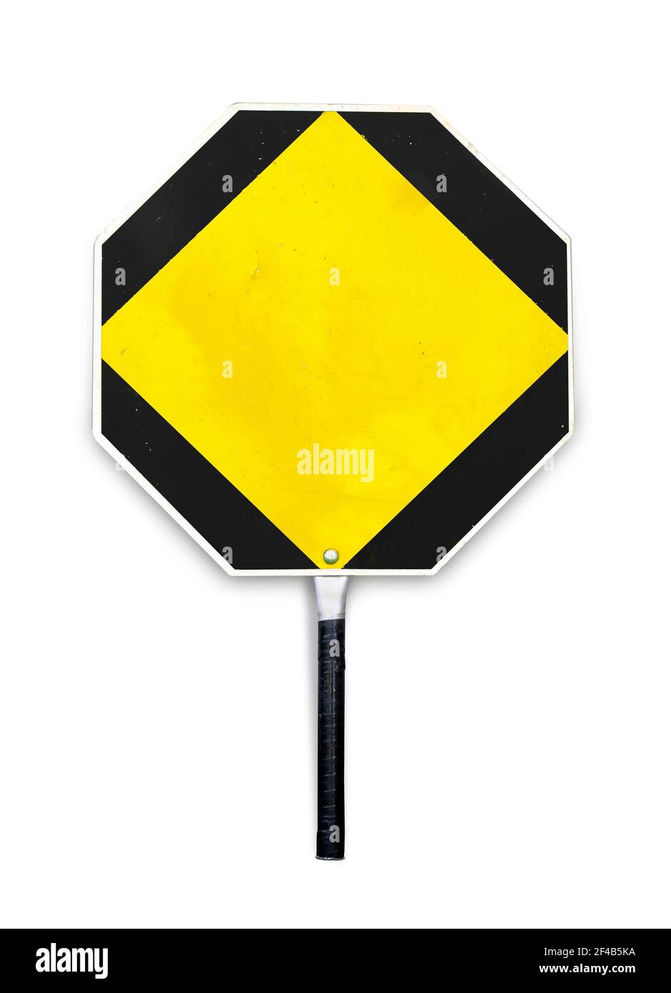 Blank yellow stop sign used for traffic control by crossing guards, police or work zones. Octagon hand-held paddle stop sign template or mockup. Aged Stock Photo