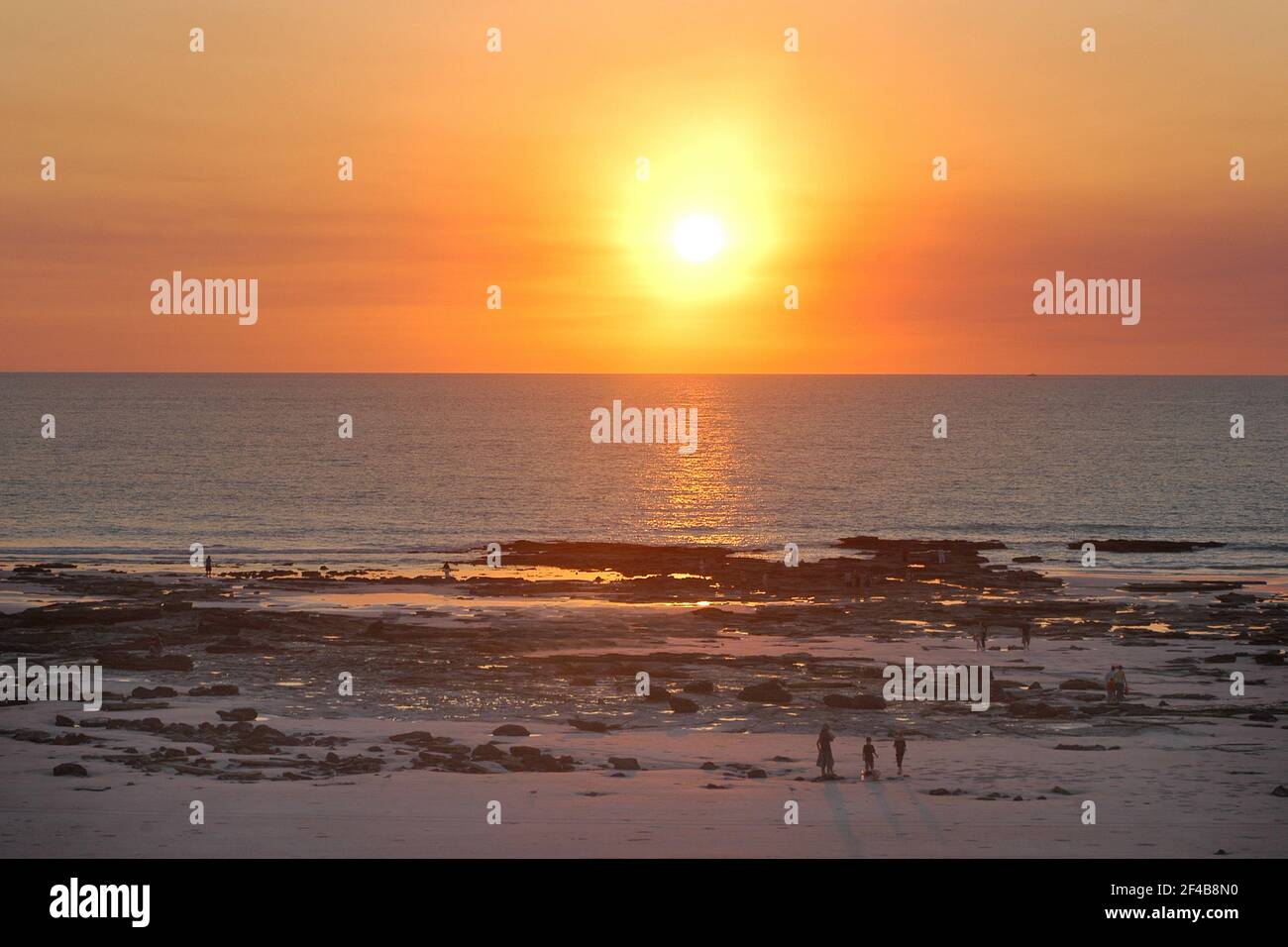 Broome is a coastal, pearling and tourist town in the Kimberley region of Western Australia. Photo shows Cable Beach at Sunset and low tide. Stock Photo