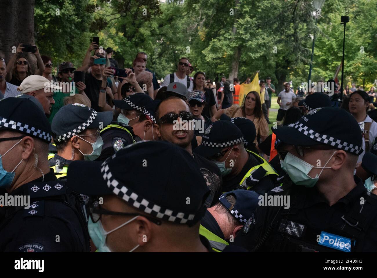 Melbourne, Australia. 20th Mar 2021. Police arrest a man in Flagstaff Gardens at a worldwide protest for freedom against the COVID-19 vaccination. March 20, Melbourne, Australia. Credit: Jay Kogler/Alamy Live News Stock Photo