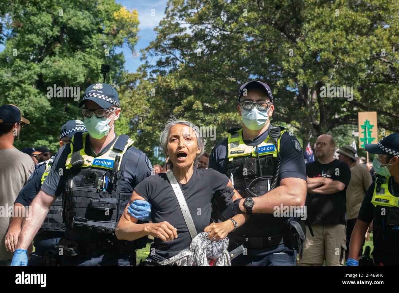 Melbourne, Australia. 20th Mar 2021. A frequent trouble-maker is taken away by police at a worldwide protest for freedom against the COVID-19 vaccination. March 20, Melbourne, Australia. Credit: Jay Kogler/Alamy Live News Stock Photo