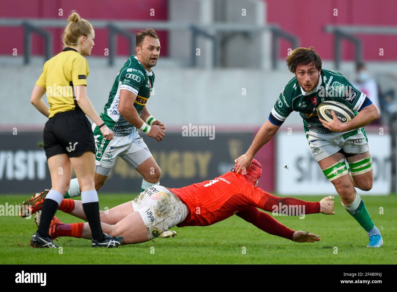 Limerick, Ireland. 19th Mar, 2021. Giovanni Pettinelli of Benetton tackled  by Chris Cloete of Munster during the Guinness PRO14 Round 16 match between  Munster Rugby and Benetton Rugby at Thomond Park in