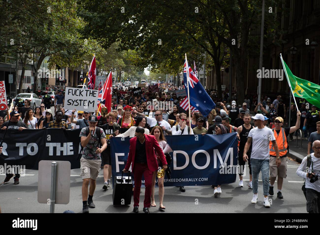 Melbourne, Australia 20 March 2021, Marchers take to the streets at the Freedom Rally which was part of a demonstration of the planned 'World Wide Rally for Freedom' that was organised to call for freedom of choice, speech and movement. Credit: Michael Currie/Alamy Live News Stock Photo