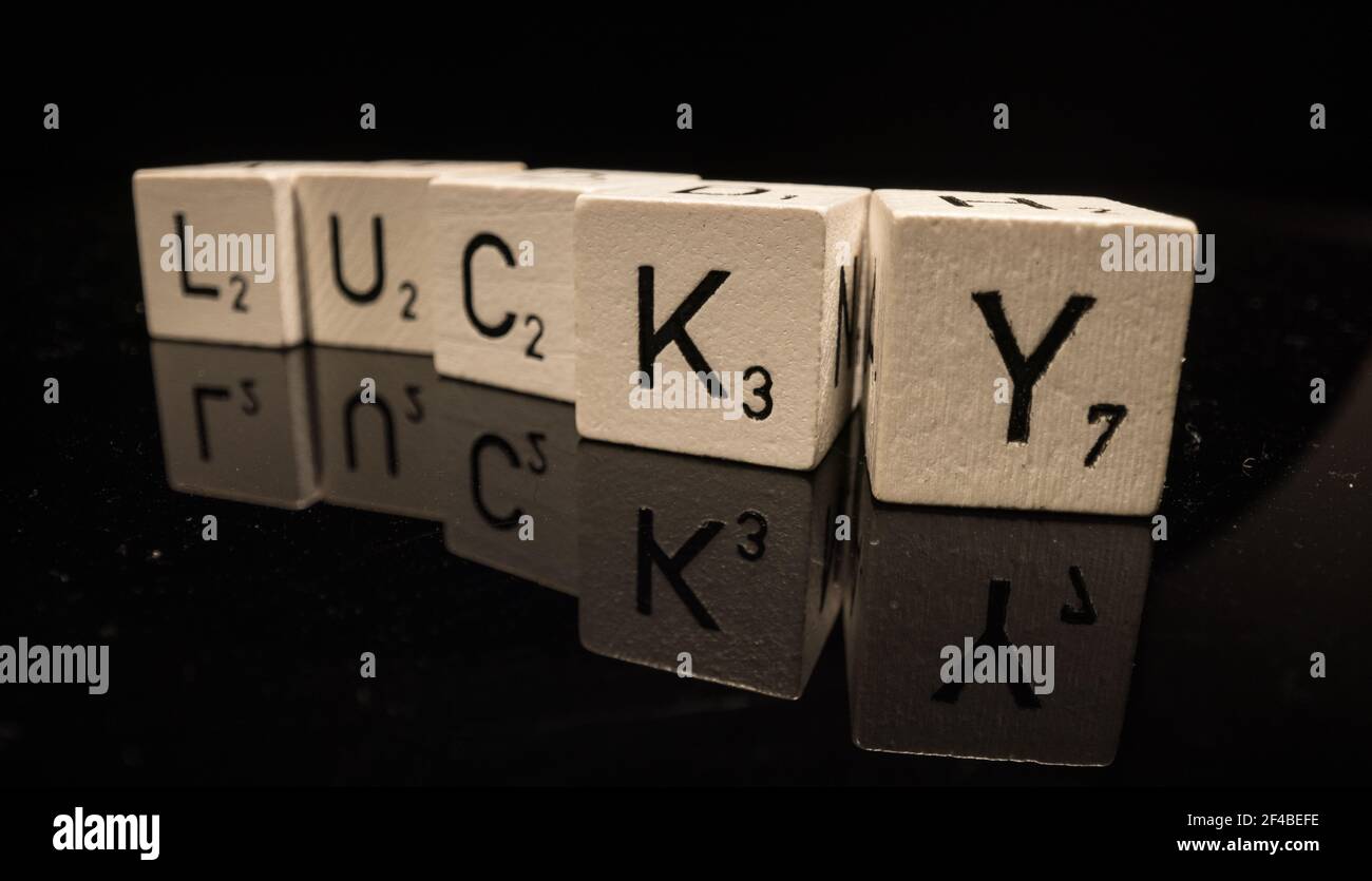 Letters on cubes write the word Lucky Stock Photo