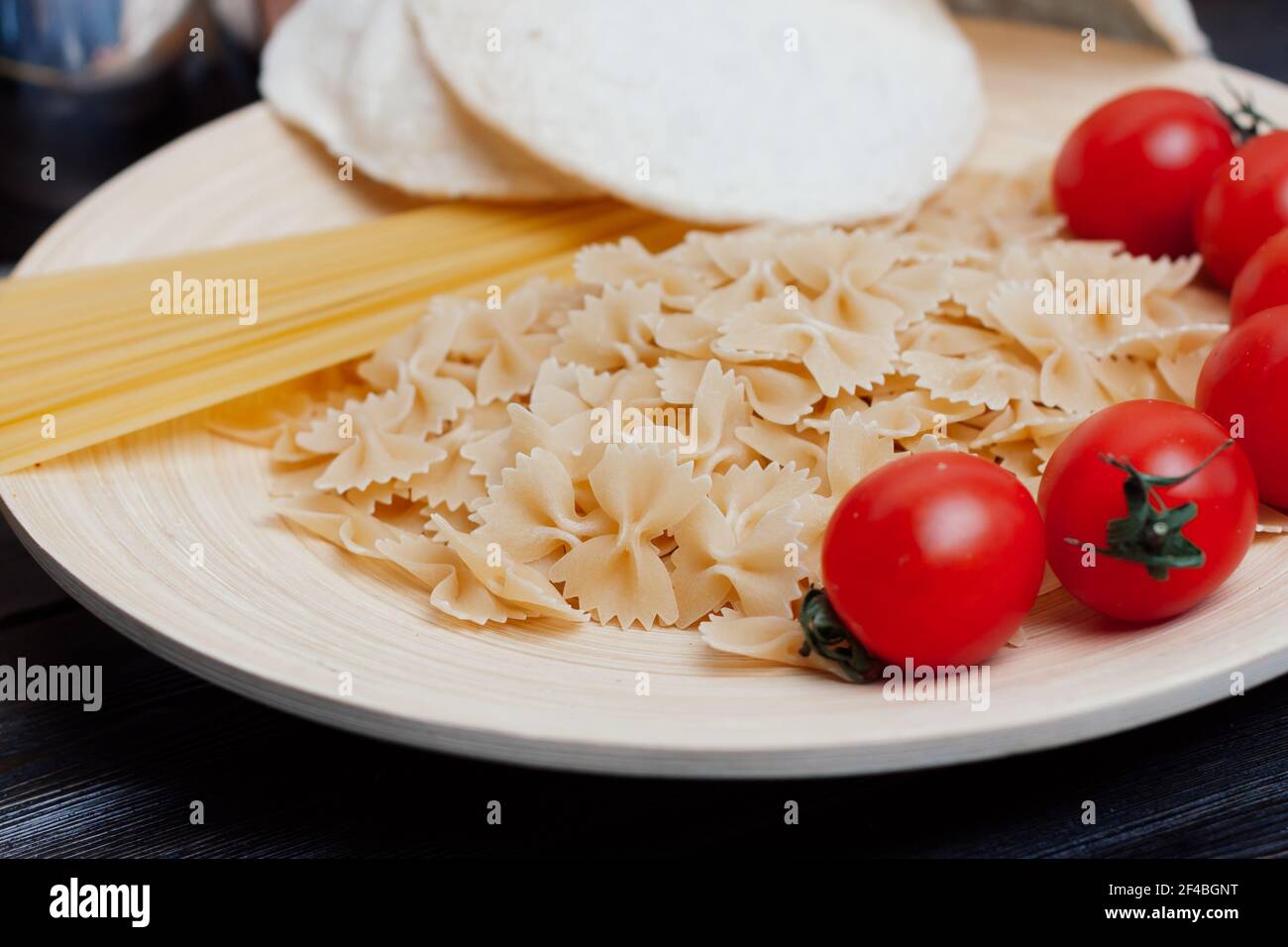 Italian pasta kitchen cooking wood table ingredients cherry tomatoes