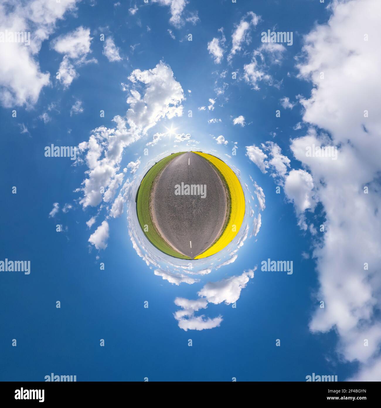tiny planet in blue sky with sun and beautiful clouds. Transformation ...