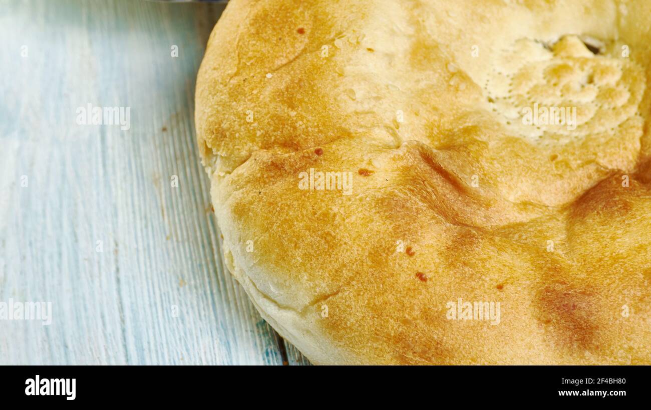 Tandyr nan Uzbek bread, a type of Central Asian bread, often decorated by  stamping patterns on the dough by using a bread stamp known as a chekich,  al Stock Photo - Alamy