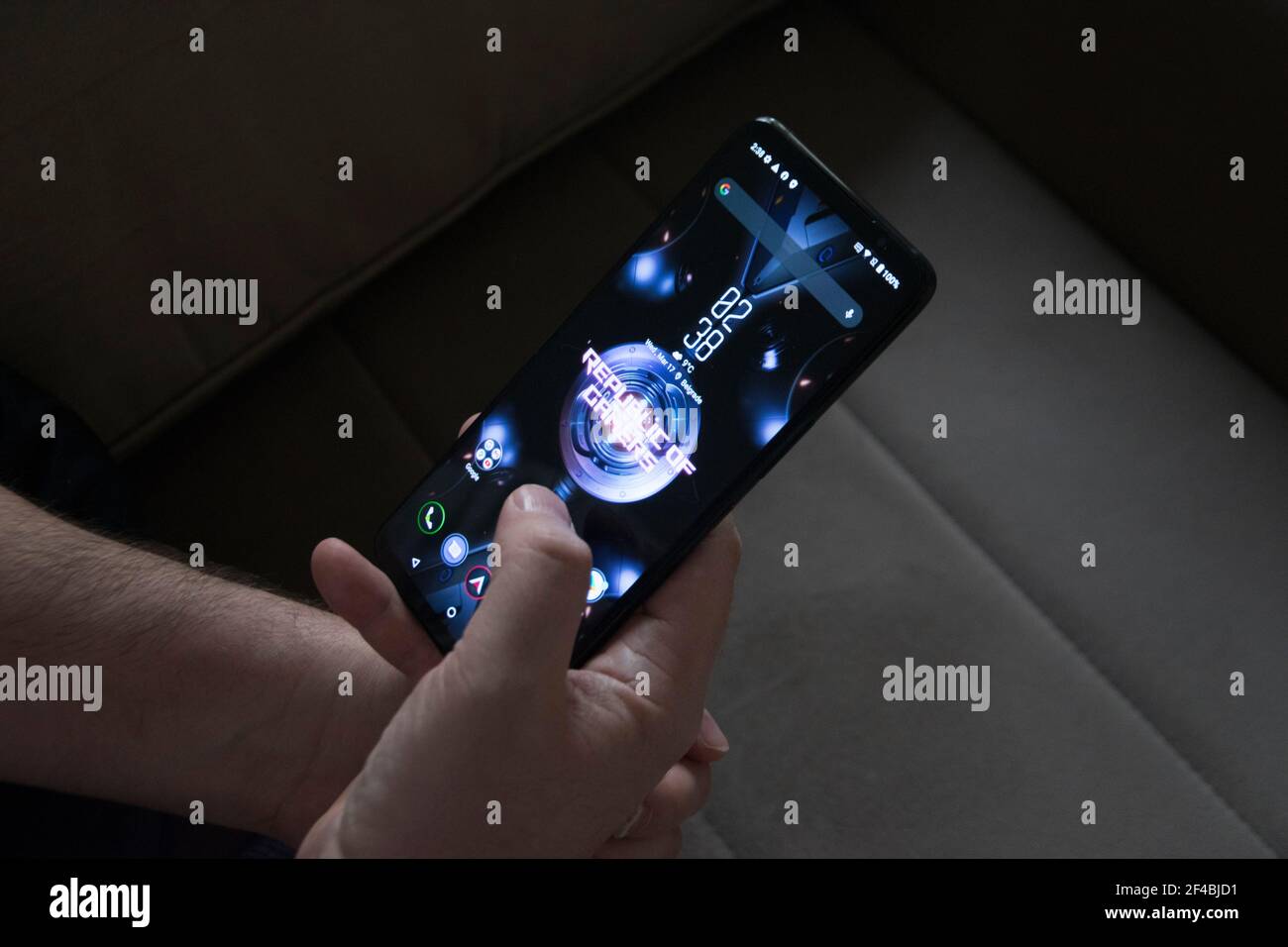 Belgrade, Serbia – March 17th, 2021: A Man Holding Asus ROG Phone 5 Stock Photo