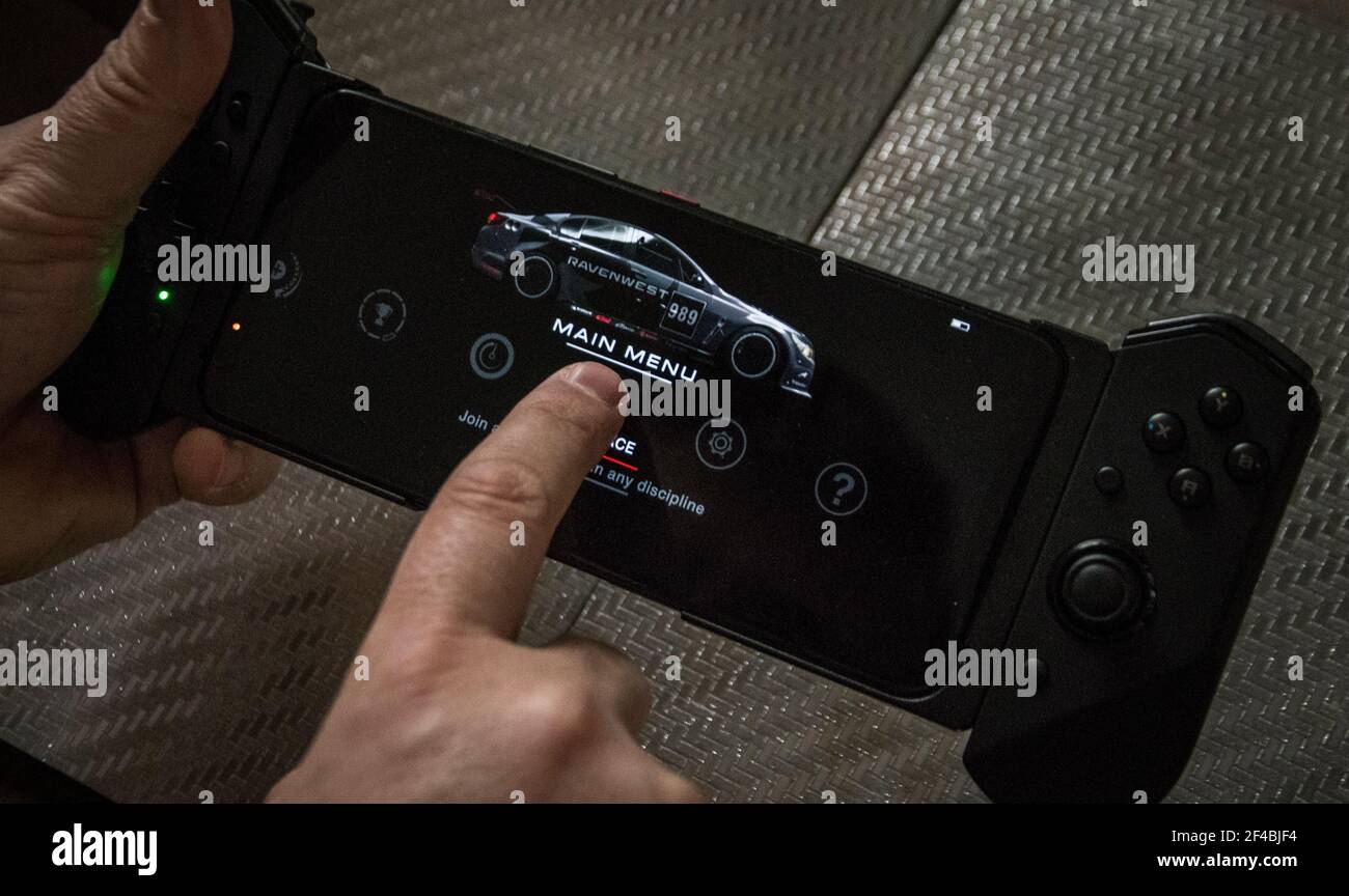 Belgrade, Serbia – March 19th, 2021: A Man Playing GRID Autosport on Asus ROG Phone 5 Stock Photo