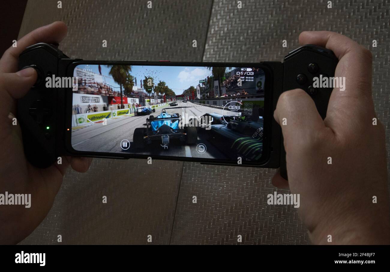 Belgrade, Serbia – March 19th, 2021: A Man Playing GRID Autosport on Asus ROG Phone 5 Stock Photo