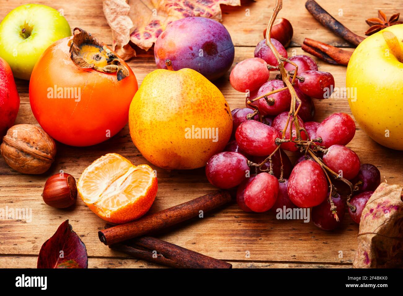 Assortment of fruits,grapes and nuts.Autumn fruits.Autumn seasonal harvest Stock Photo