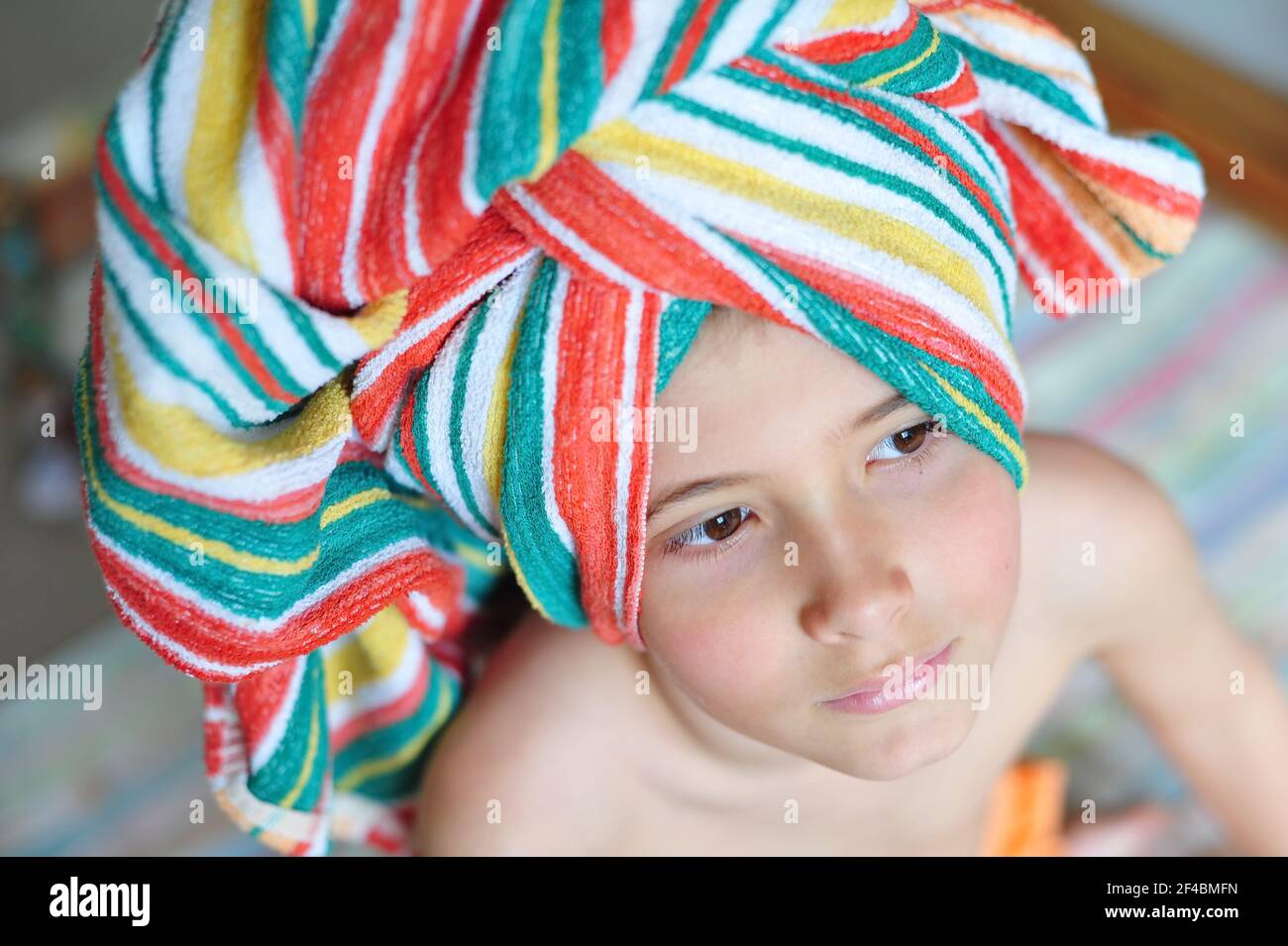 Cute little boy with towel on his head in mexican style. Stock Photo