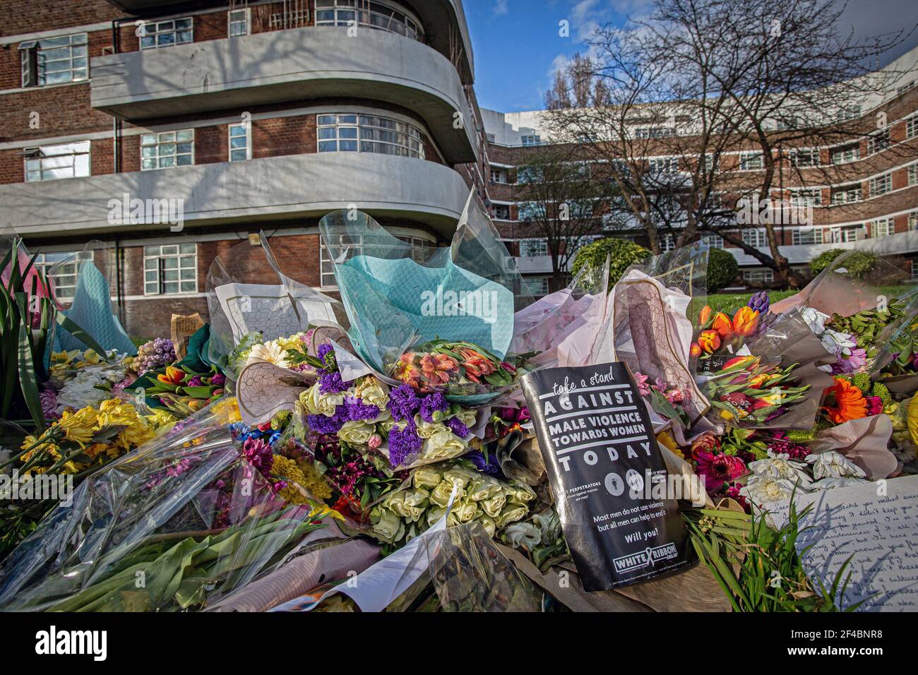 Sign and Flowers in Memory of Sarah Everard along the A205 Poynders Road, at the junction with Cavendish Road in Clapham, south London, after CCTV of Stock Photo