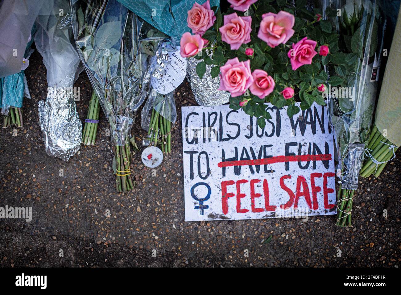 Sign and Flowers in Memory of Sarah Everard on Clapham Common, London UK. Stock Photo