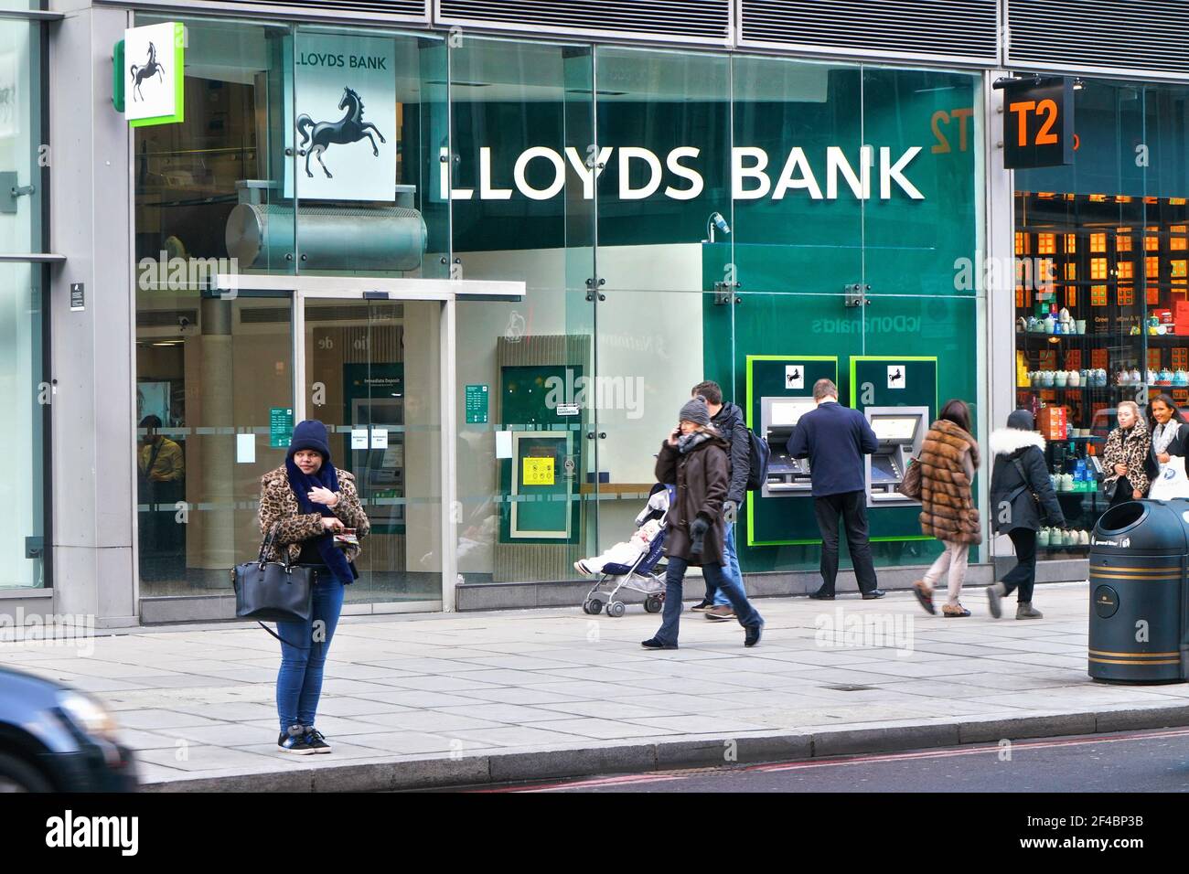 London, United Kingdom - February 02, 2019: People walk in front of Lloyds Bank branch at Victoria. It is British retail and commercial bank founded 1 Stock Photo