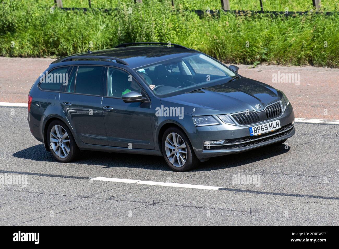 2019 grey Skoda Octavia Se L Tdi S-A 1968cc diesel estate car; Vehicular traffic, moving vehicles, cars, vehicle driving on UK roads, motors, motoring on the M6 highway English motorway road network Stock Photo