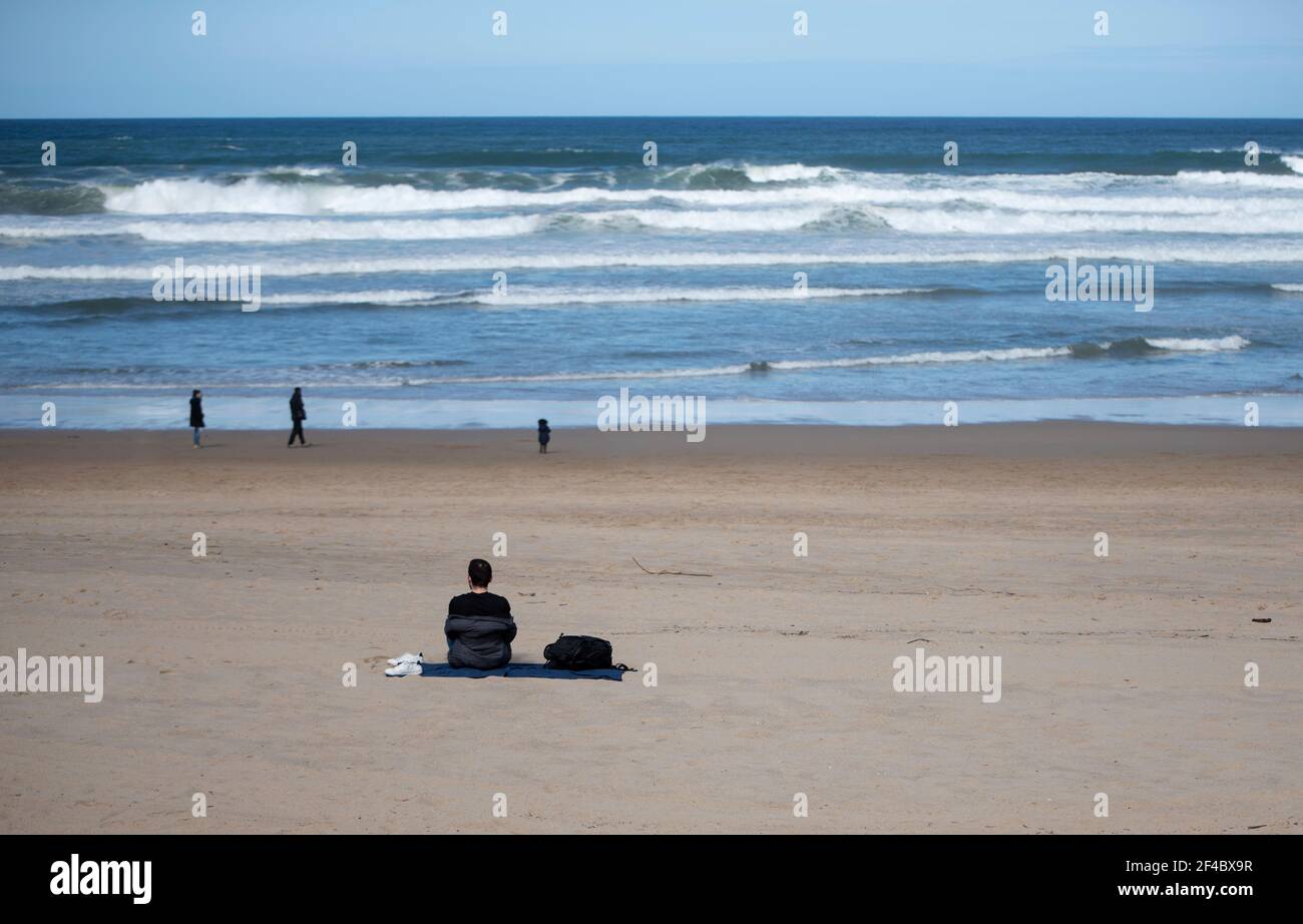 sitting on the beach looking at the sea Stock Photo - Alamy