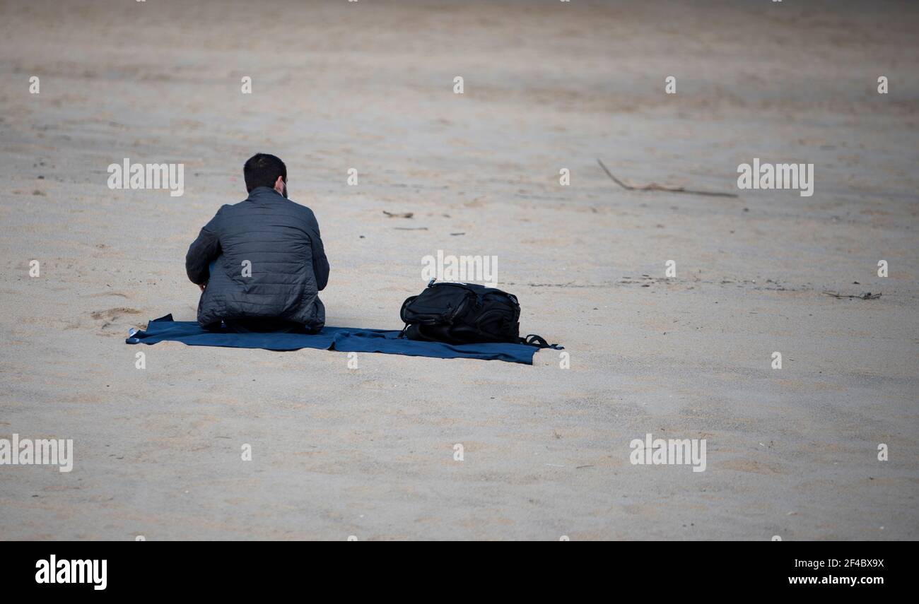 sitting on the beach looking at the sea Stock Photo - Alamy