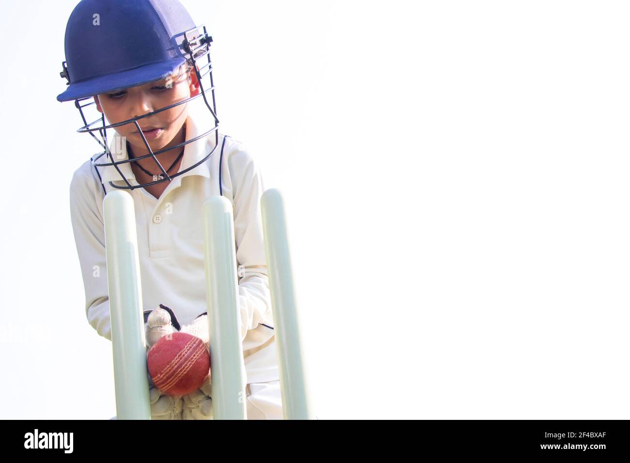 a boy wicket keepers during cricket game Stock Photo Alamy