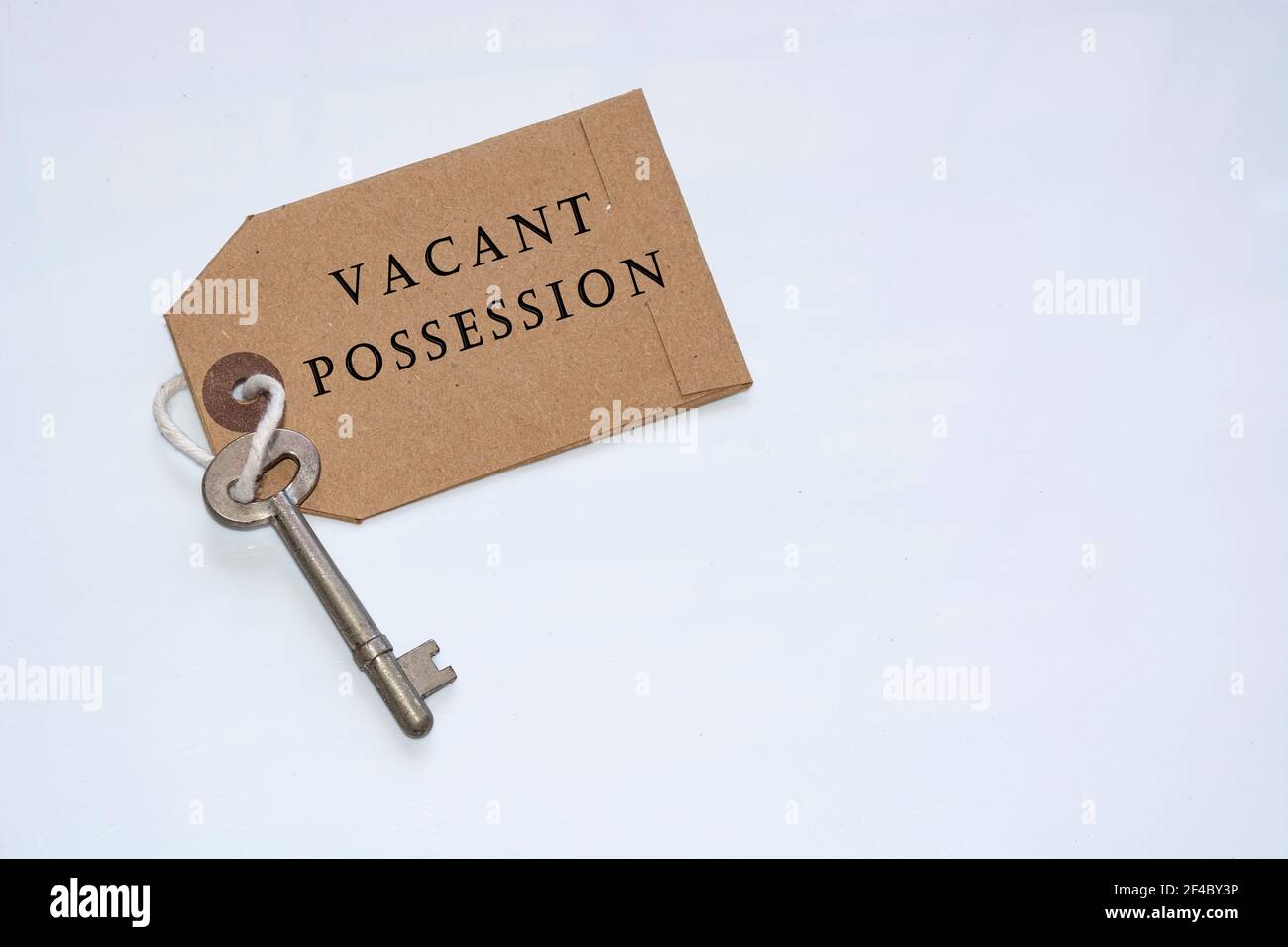 Text on a tag with key - Vacant possession Stock Photo
