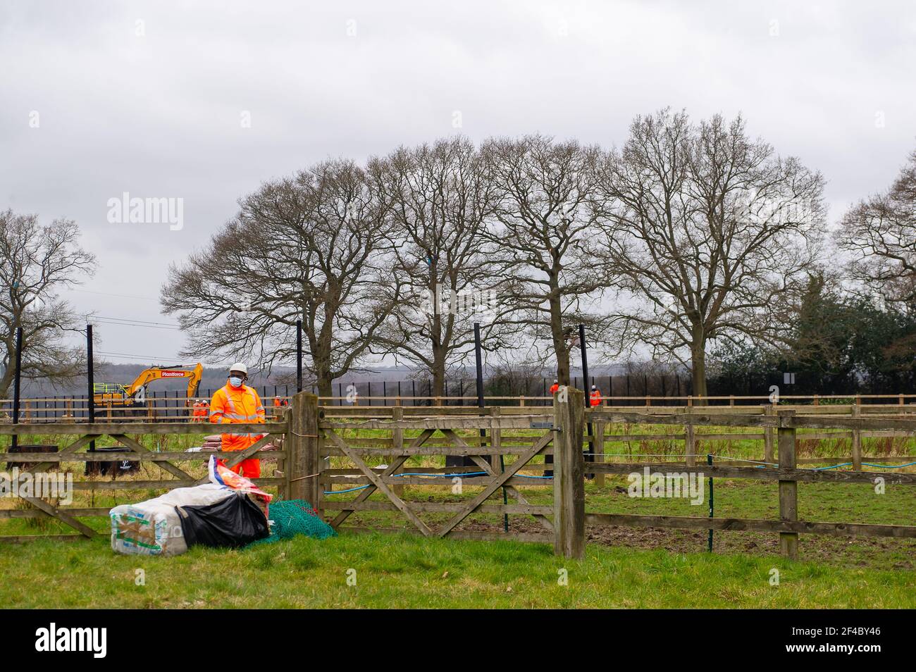Great Missenden, Buckinghamshire, UK. 18th March, 2021. HS2 have destroyed three oak trees in Leather Lane with more to follow for a temporary haul road despite that there are bat holes in the trees and it is the bird nesting season. HS2 Security and NET bailiffs are in the fields next to the oaks 24/7 and intimindating local residents. The High Speed 2 rail link from London to Birmingham is carving a huge scar across the Chilterns which is an AONB. Just under 40,000 people have signed a petition to Save Leather Lane Oaks from HS2. Credit: Maureen McLean/Alamy Stock Photo