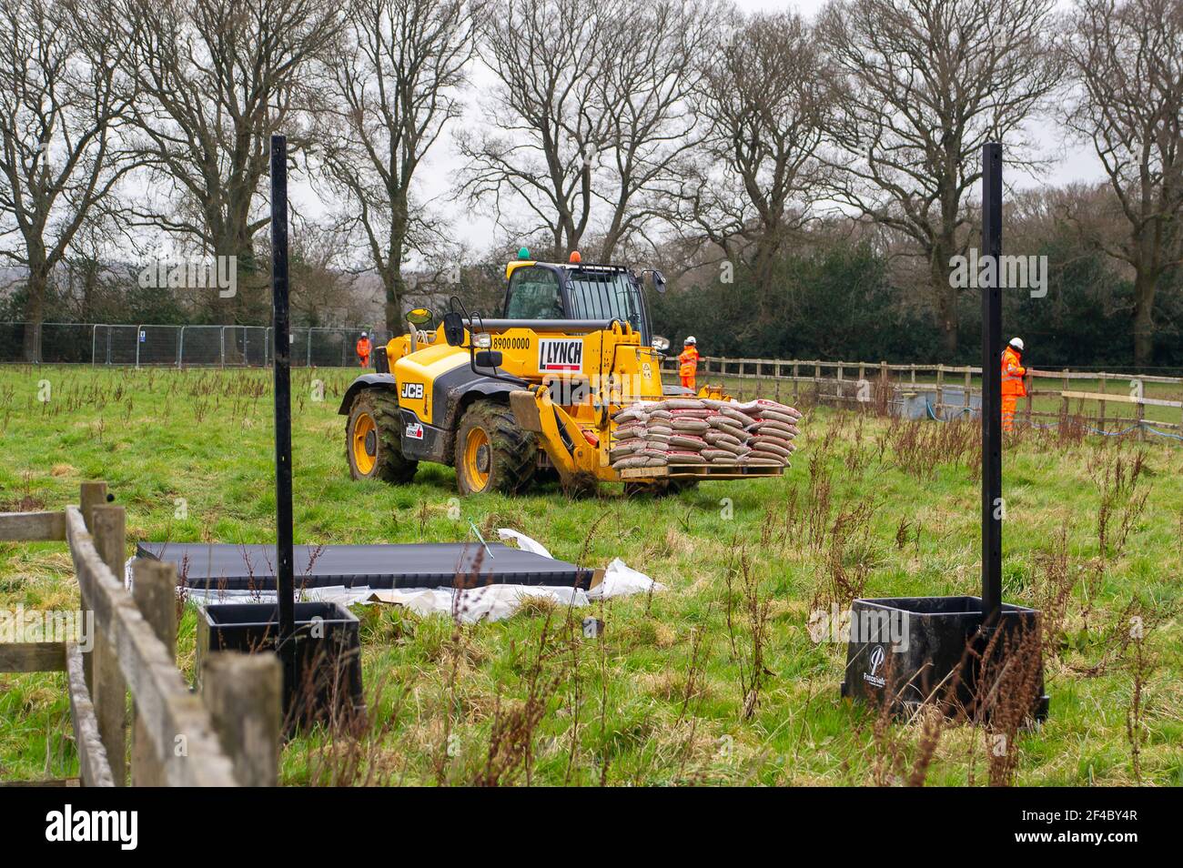 Great Missenden, Buckinghamshire, UK. 18th March, 2021. HS2 have destroyed three oak trees in Leather Lane with more to follow for a temporary haul road despite that there are bat holes in the trees and it is the bird nesting season. HS2 Security and NET bailiffs are in the fields next to the oaks 24/7 and intimindating local residents. The High Speed 2 rail link from London to Birmingham is carving a huge scar across the Chilterns which is an AONB. Just under 40,000 people have signed a petition to Save Leather Lane Oaks from HS2. Credit: Maureen McLean/Alamy Stock Photo