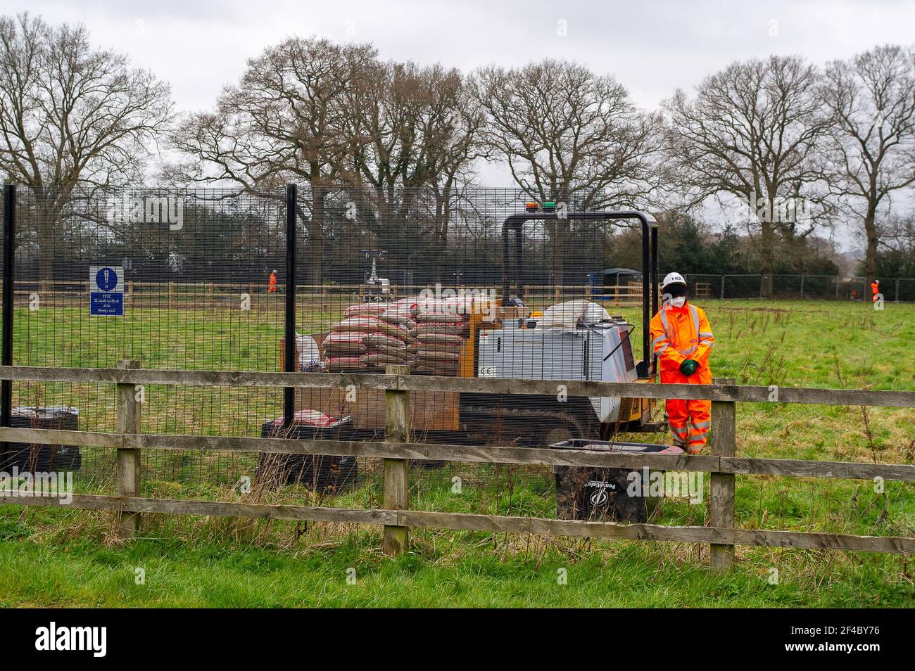 Great Missenden, Buckinghamshire, UK. 18th March, 2021. HS2 have destroyed three oak trees in Leather Lane with more to follow for a temporary haul road despite that there are bat holes in the trees and it is the bird nesting season. HS2 Security and NET bailiffs are in the fields next to the oaks 24/7 and intimindating local residents. The High Speed 2 rail link from London to Birmingham is carving a huge scar across the Chilterns which is an AONB. Just under 40,000 people have signed a petition to Save Leather Lane Oaks from HS2. Credit: Maureen McLean/Alamy Stock Photo