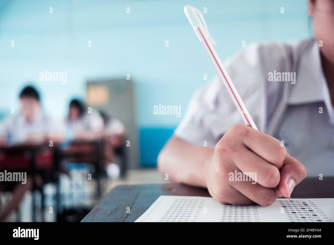 Student taking educational exam test in class with stress Stock Photo