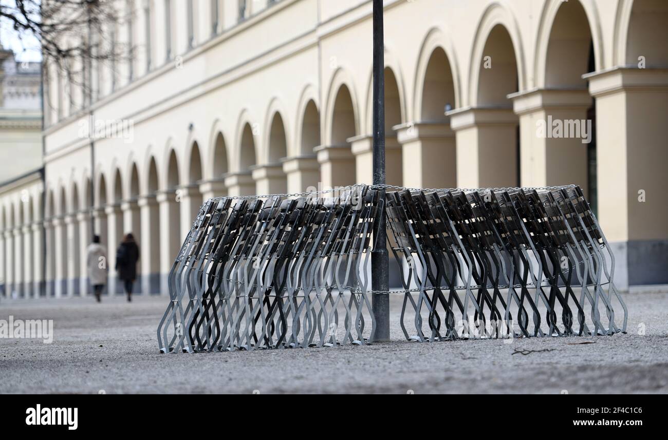 Munich, Germany. 20th Mar, 2021. Beer garden chairs are lined up in the