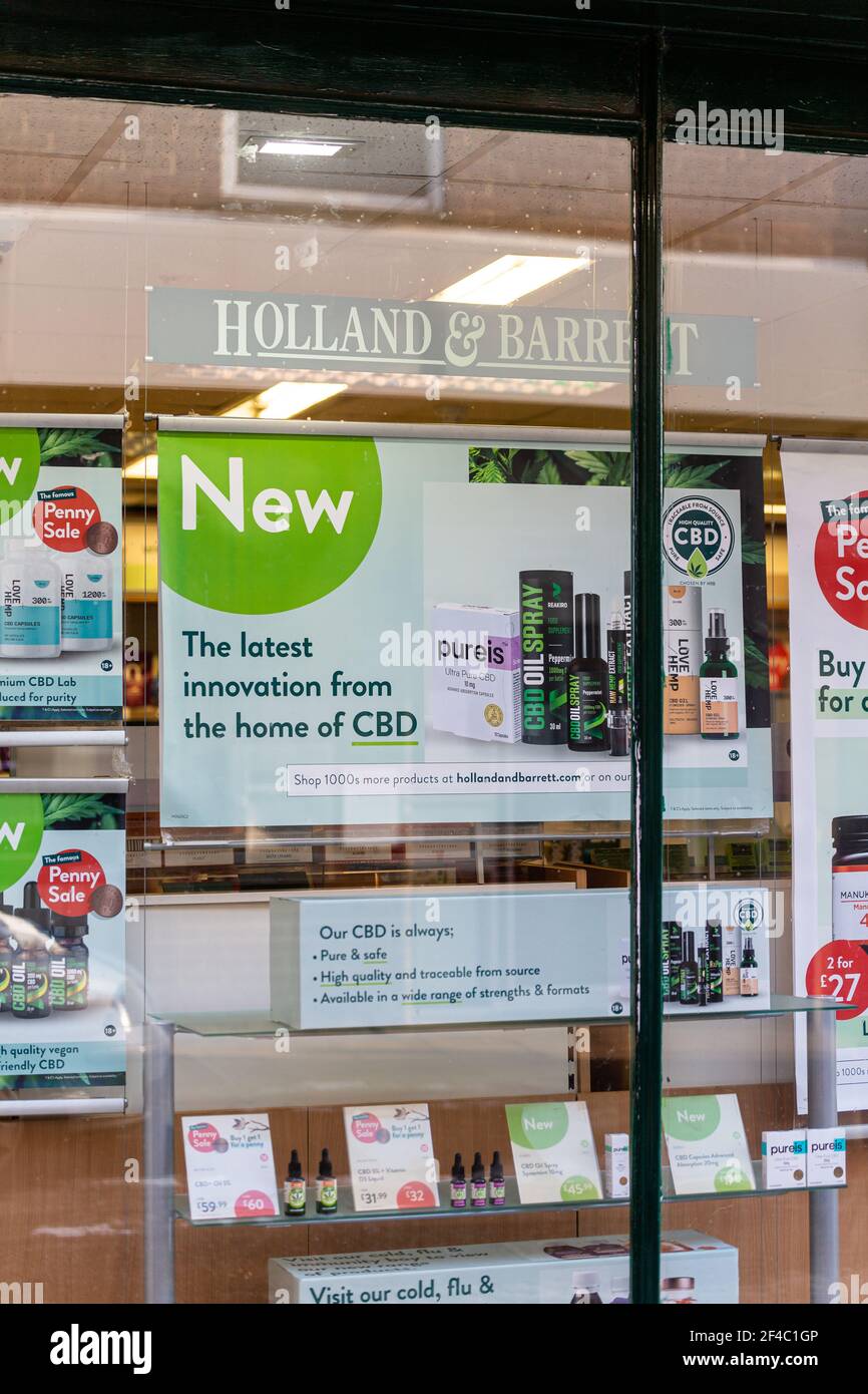 Woodbridge, Suffolk, UK February 10 2021: A shop display in the UK showing the now legal CBD oil prodicts. Alternative natural medicine concept Stock Photo