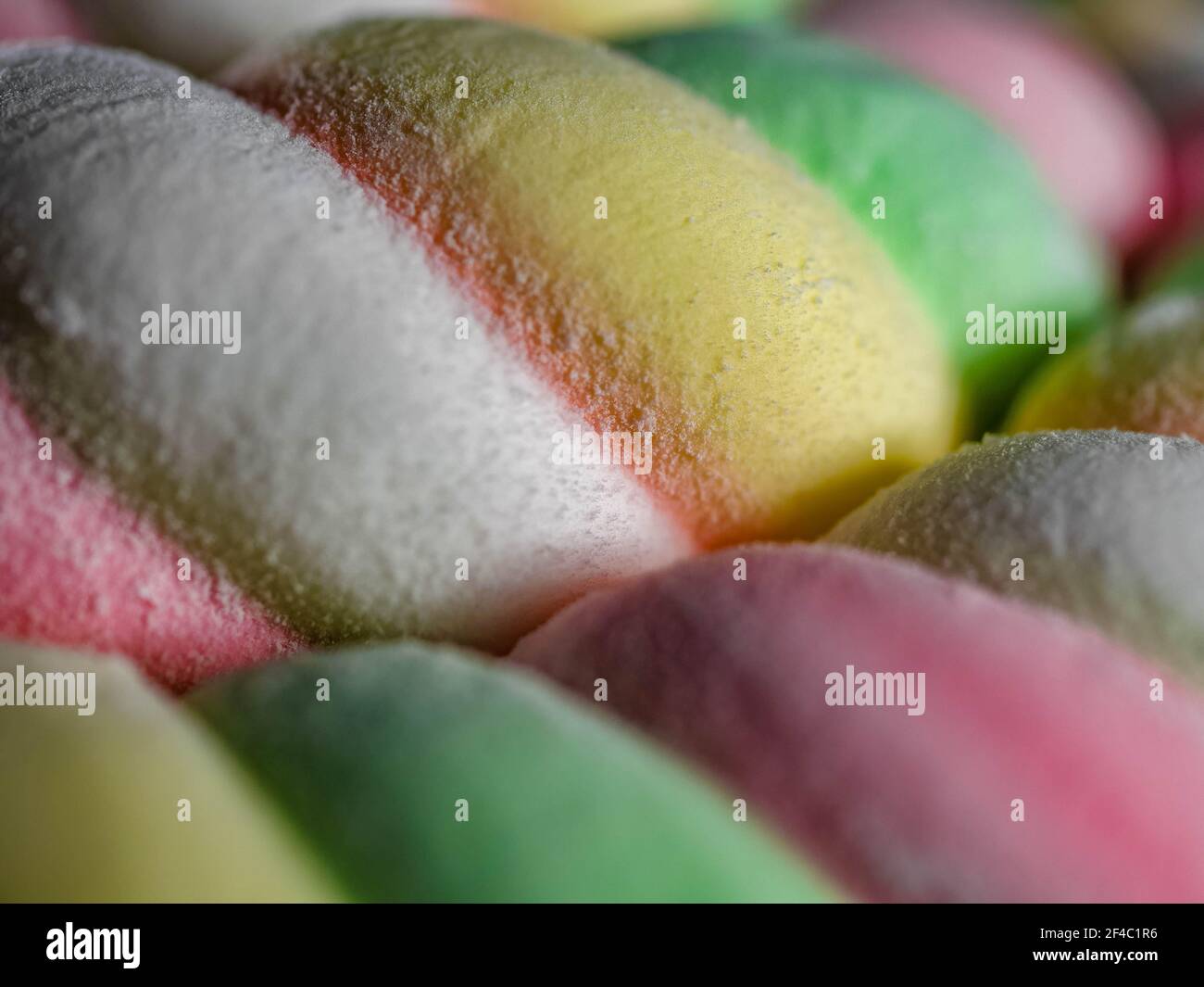 Background of twisted, colorful marshmallow, close up, macro Stock