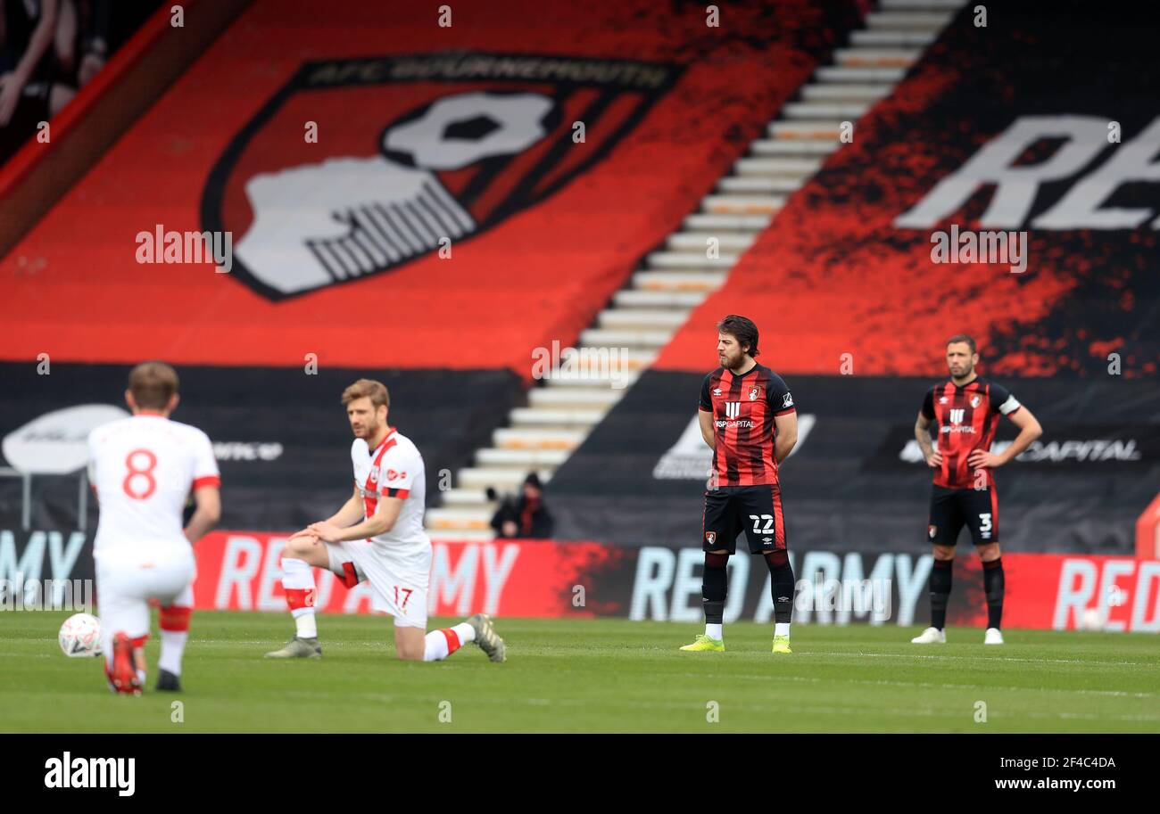 AFC Bournemouth's Ben Pearson and Steve Cook stand as Southampton's James Ward-Prowse and Stuart Armstrong take a knee ahead of the Emirates FA Cup quarter final match at the Vitality Stadium, Bournemouth. Picture date: Saturday March 20, 2021. Stock Photo