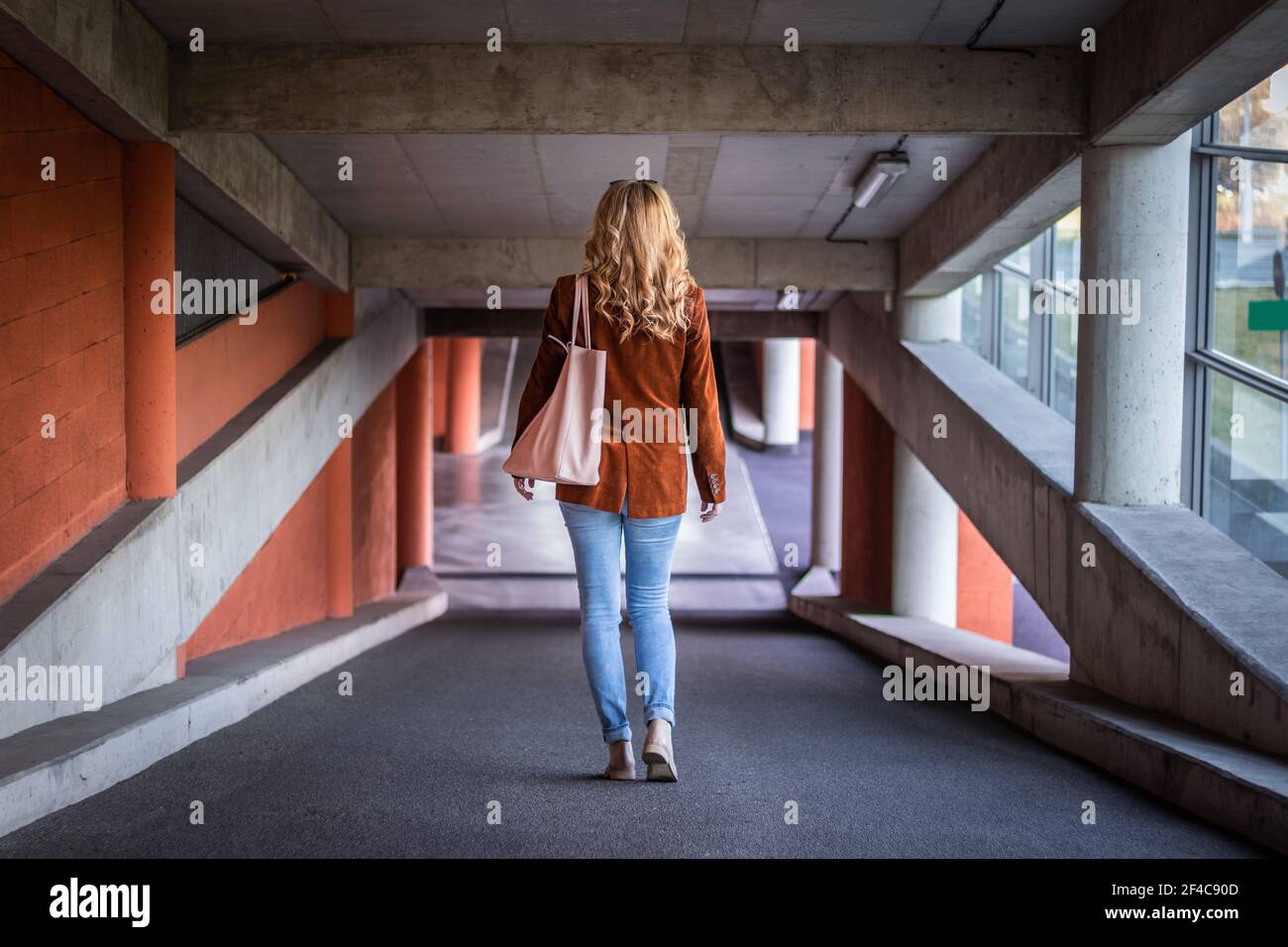 car park. Stylish blond hair woman 