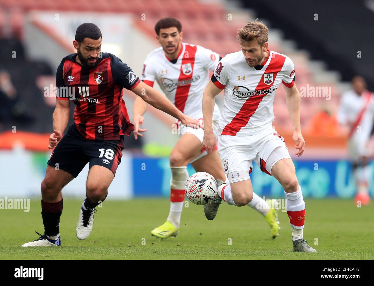 Southampton's Stuart Armstrong (right) and AFC Bournemouth's Cameron Carter-Vickers (left) battle for the ball during the Emirates FA Cup quarter final match at the Vitality Stadium, Bournemouth. Picture date: Saturday March 20, 2021. Stock Photo