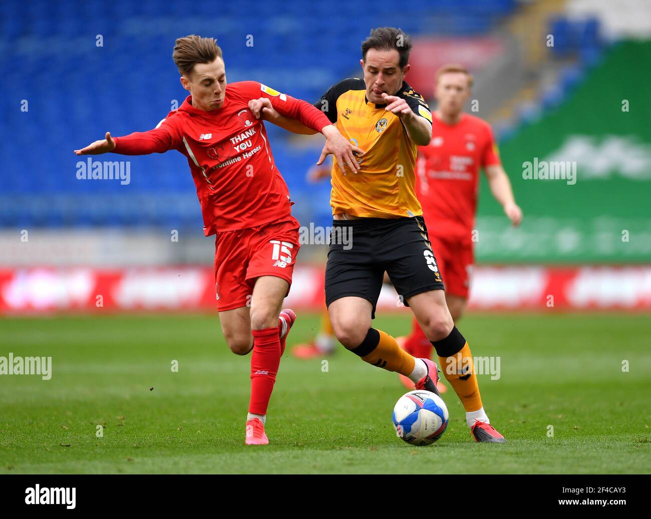 Leyton Orient's Daniel Kemp (left) and Newport County's Matt Dolan battle for the ball during the Sky Bet League Two match at the Cardiff City Stadium, Cardiff. Picture date: Saturday March 20, 2021. Stock Photo