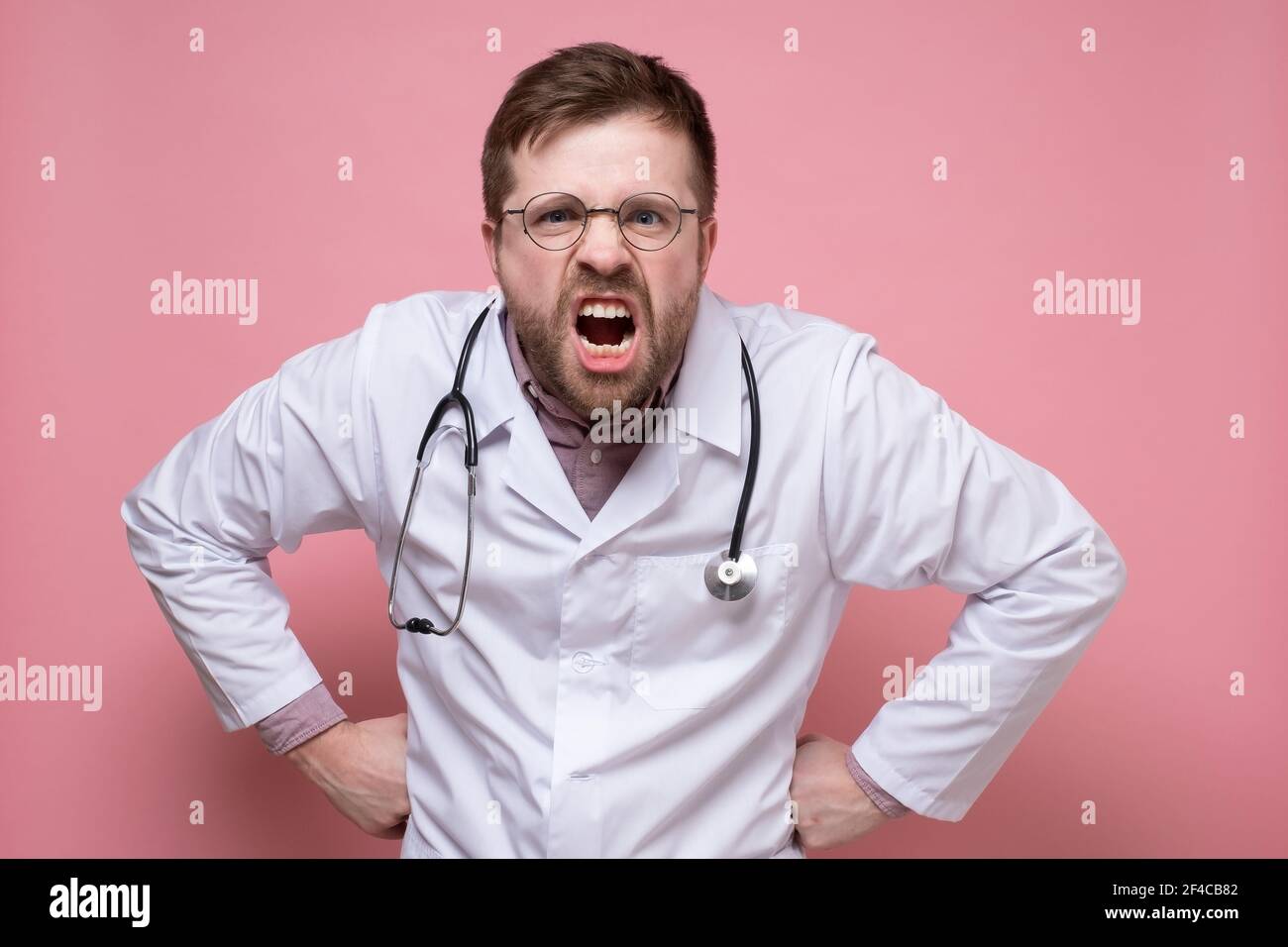Doctor wearing stethoscope around his neck hires stock photography and