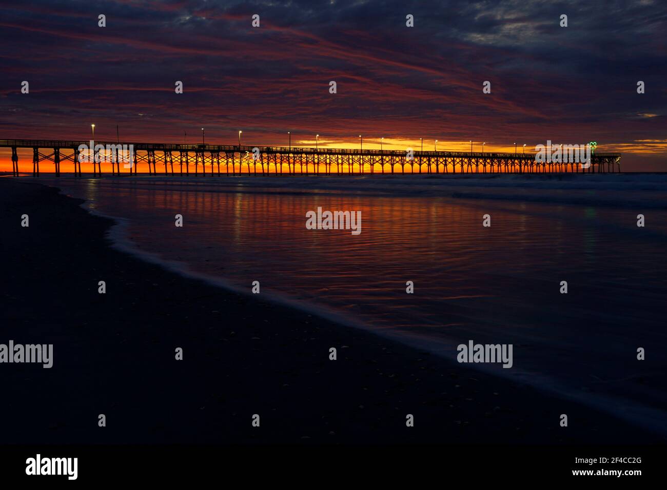 Break of dawn at Surf City Pier in North Carolina Stock Photo