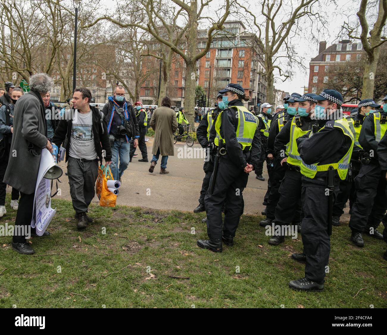 London UK 20 March 2021. Piers Corbyn English weather forecaster, businessman, activist, anti-vaxxer and conspiracy theorist arrives in Hyde Park to take part in todays anti lockdown ,anti vaccine and anti new laws to curb demonstrations ,currently been debated in parliament , walkinf=g by as police looks on . Paul Quezada-Neiman/Alamy Live News Stock Photo