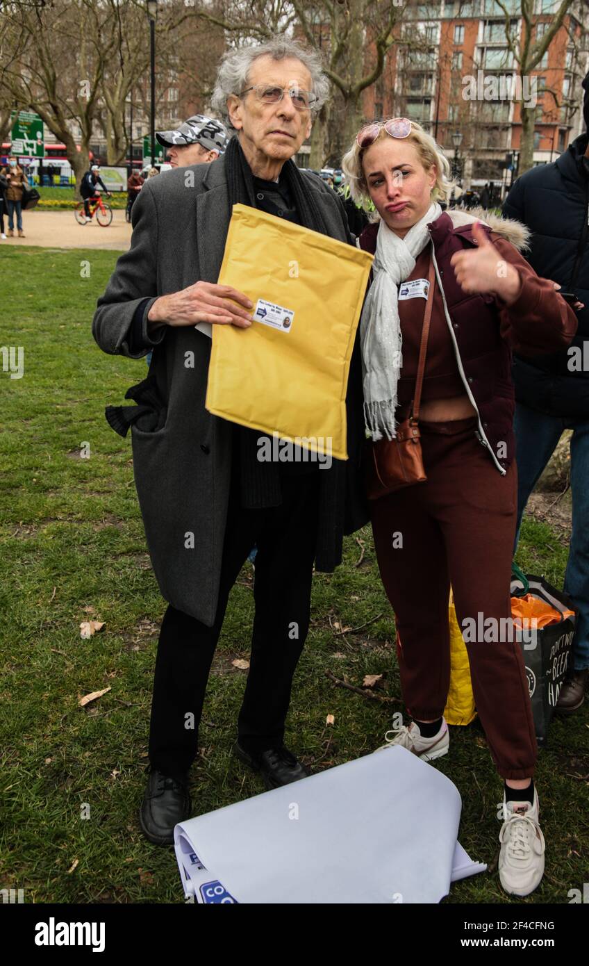 London UK 20 March 2021. Piers Corbyn English weather forecaster, businessman, activist, anti-vaxxer and conspiracy theorist arrives in Hyde Park to take part in todays anti lockdown ,anti vaccine and anti new laws to curb demonstrations ,currently been debated in parliament , giving a fan a sticker with his name and face campaigning for London Mayor . Paul Quezada-Neiman/Alamy Live News Stock Photo