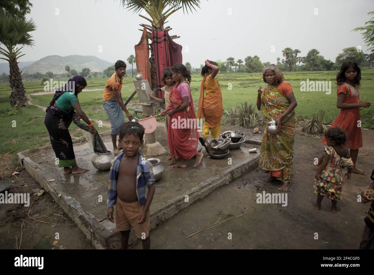 Villagers taking water from a communal water pump in Faldu village near Nalanda in Bihar, India. Since 2015, water-use efficiency has increased by 4% globally, according to UN Water in their Summary Progress Update 2021 published on March 1, 2021 in Geneva. Stock Photo