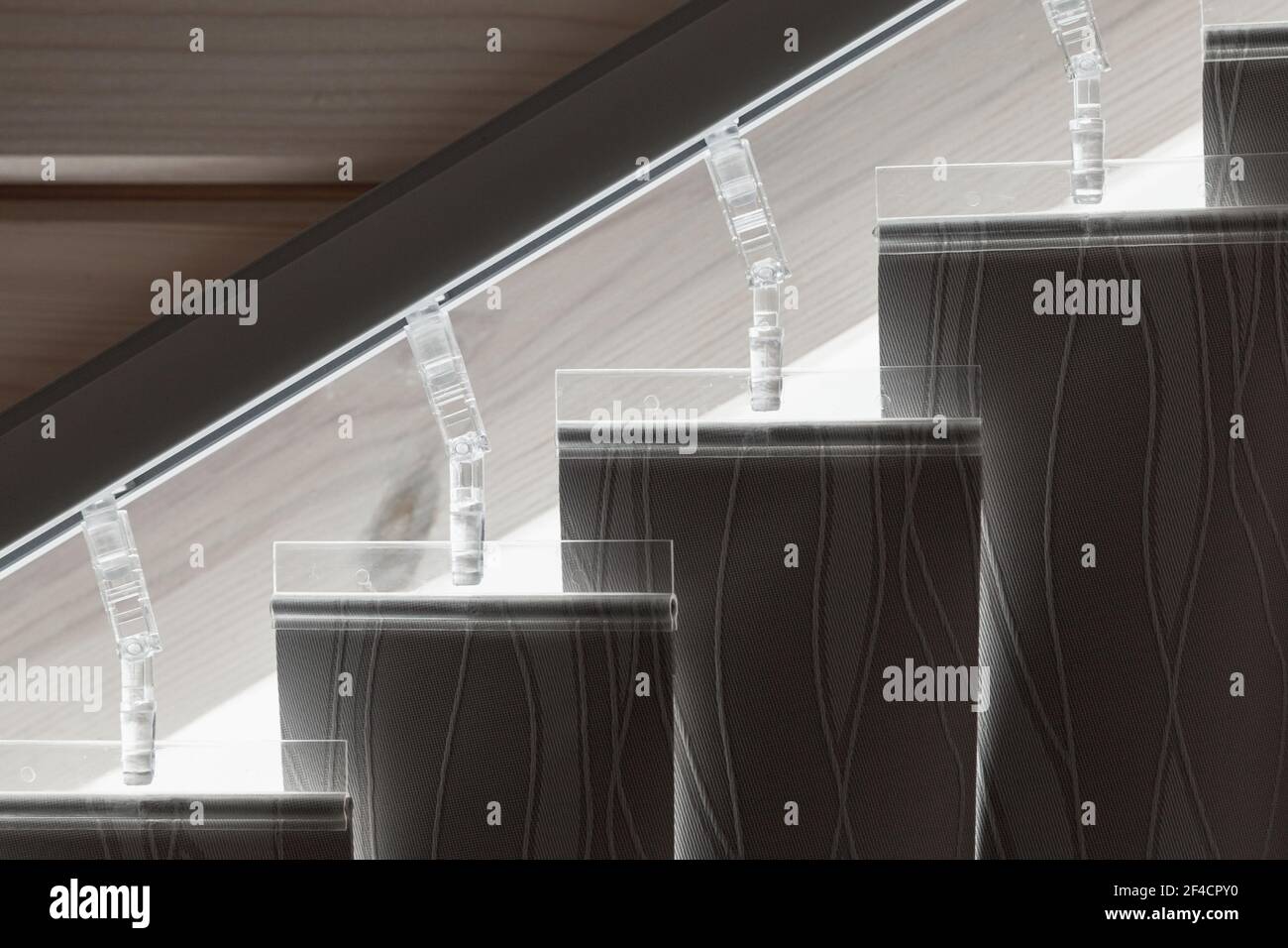 Standard vertical blinds on an inclined track, closeup photo Stock