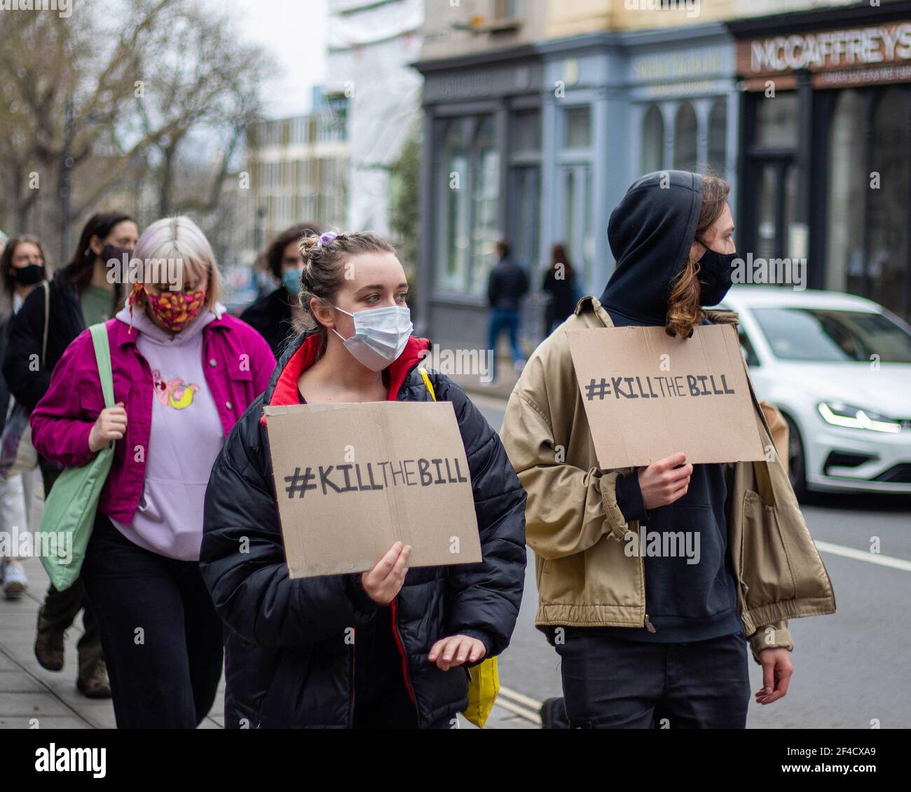 People marching through the High Streets in Cheltenham holding a sign '#KILLTHEBILL' to protest the introduction of the restriction to the right of protest. 20/02/2021 Stock Photo