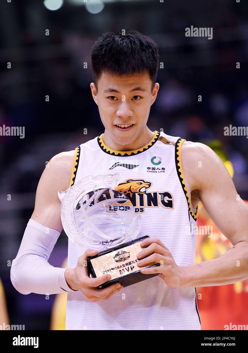 Qingdao, China's Shandong Province. 20th Mar, 2021. Zhang Zhenlin of the North Team poses with his MVP trophy after the CBA All-Star Rookie Challenge at the 2020-2021 Chinese Basketball Association (CBA) league in Qingdao, east China's Shandong Province, March 20, 2021. Credit: Li Ziheng/Xinhua/Alamy Live News Stock Photo