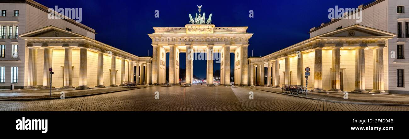 Panorama of the illuminated Brandenburg Gate in Berlin at night Stock Photo