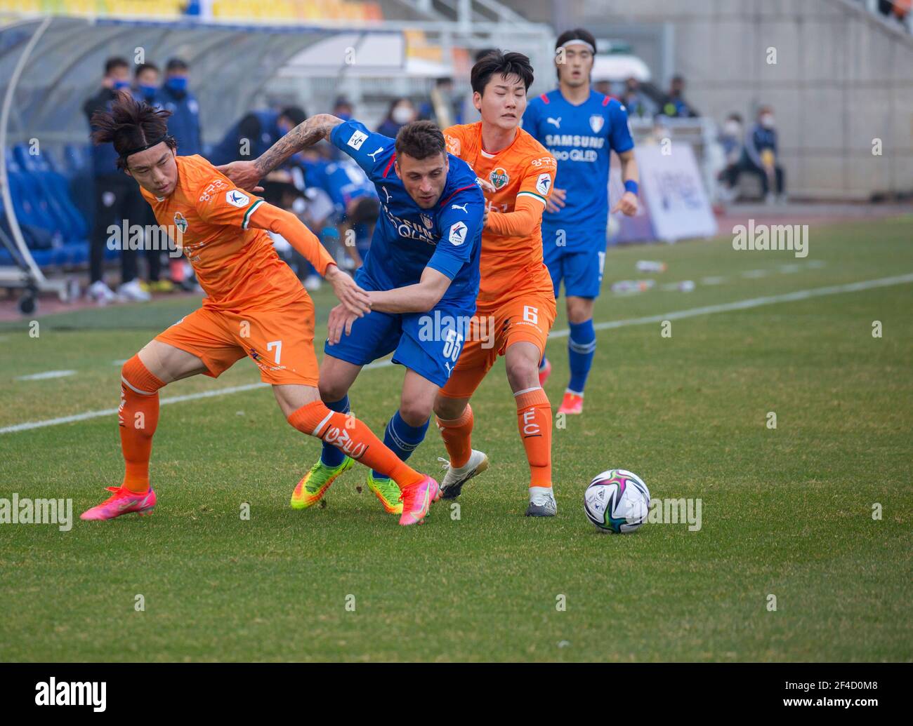 (L-R) Yun Suk-Young (L), Uros Deric of Suwon Samsung Bluewings and Kim Dong-Hyun of Gangwon FC in action during the 4th round of the 2021 K League 1 soccer match between Suwon Samsung Bluewings and Gangwon FC at the Suwon World Cup Stadium.Final score; Suwon Samsung Bluewings 1:1 Gangwon FC. Stock Photo