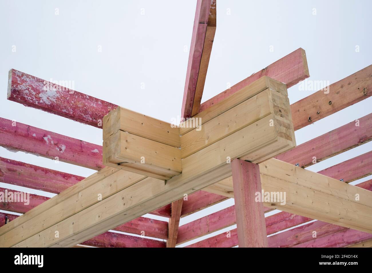 Unfinished roof rafters arrangemenrt against the sky, winter scene ...