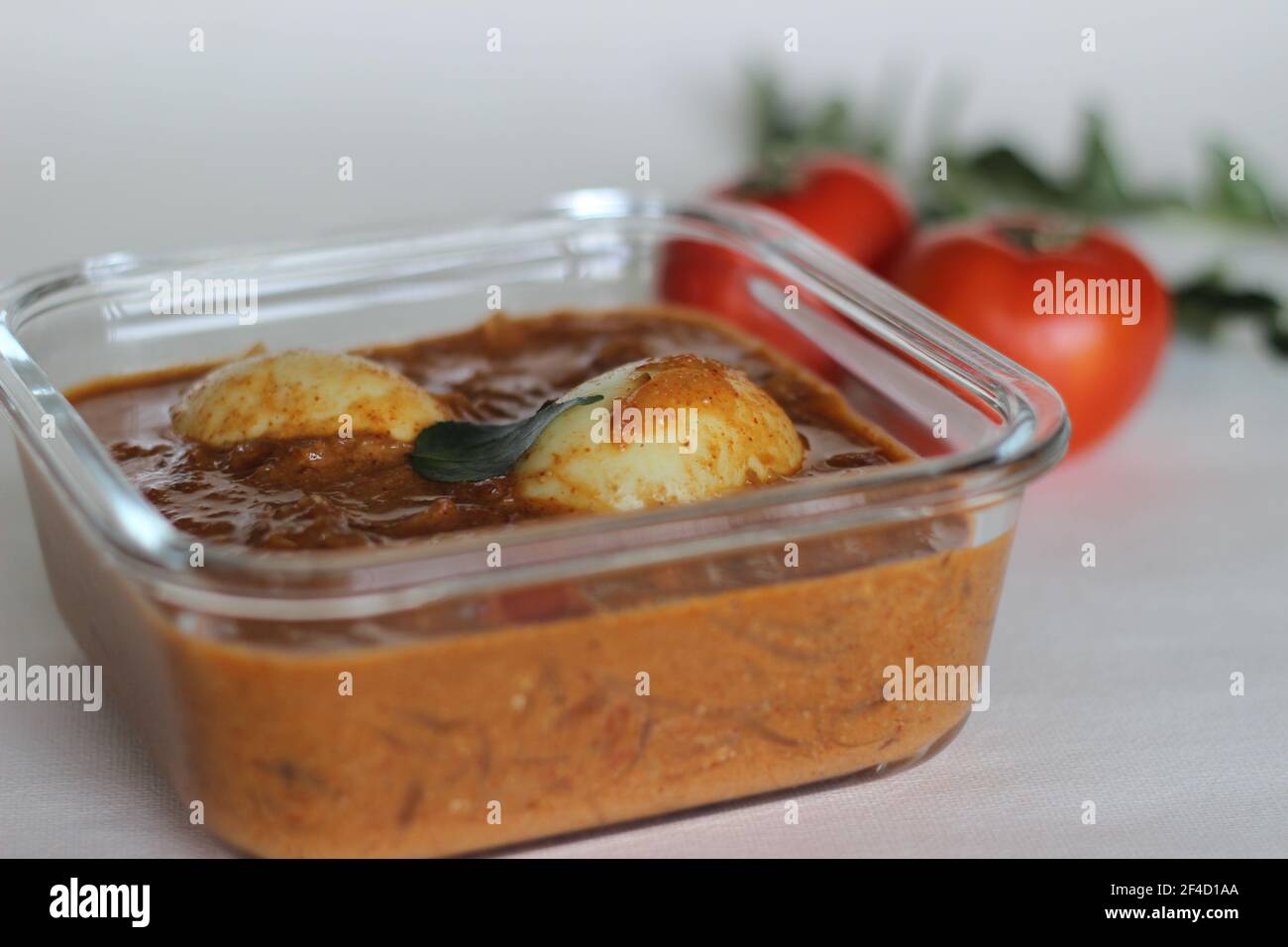 Egg curry. Boiled eggs in a cashew tomato based gravy. Shot on white