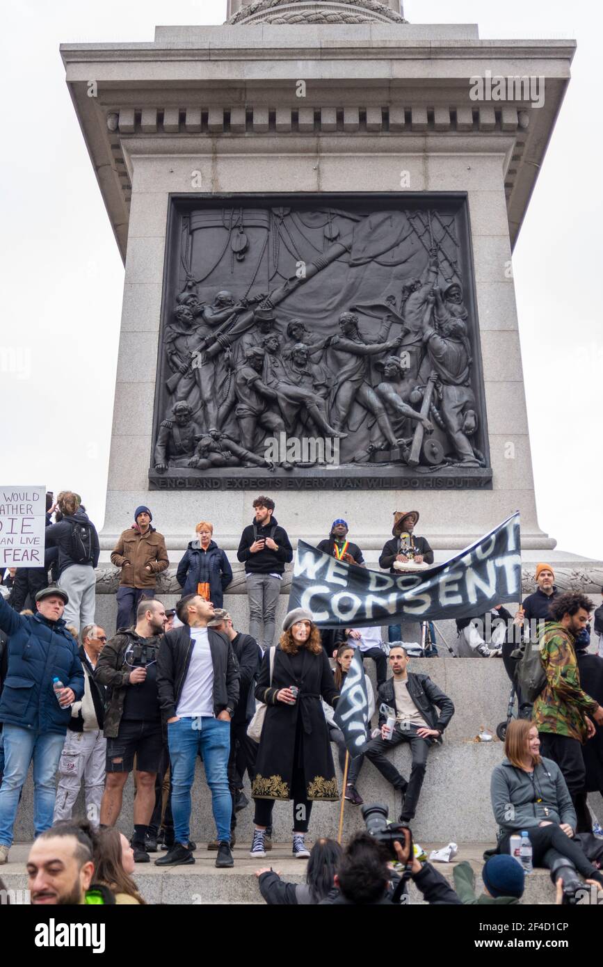 Westminster, London, UK. 20th Mar, 2021. Anti-lockdown protesters have gathered in Trafalgar Square and the base around Nelson's Column. Large numbers of protesters have marched around Westminster, bringing traffic to a standstill in Whitehall and Parliament Square Stock Photo