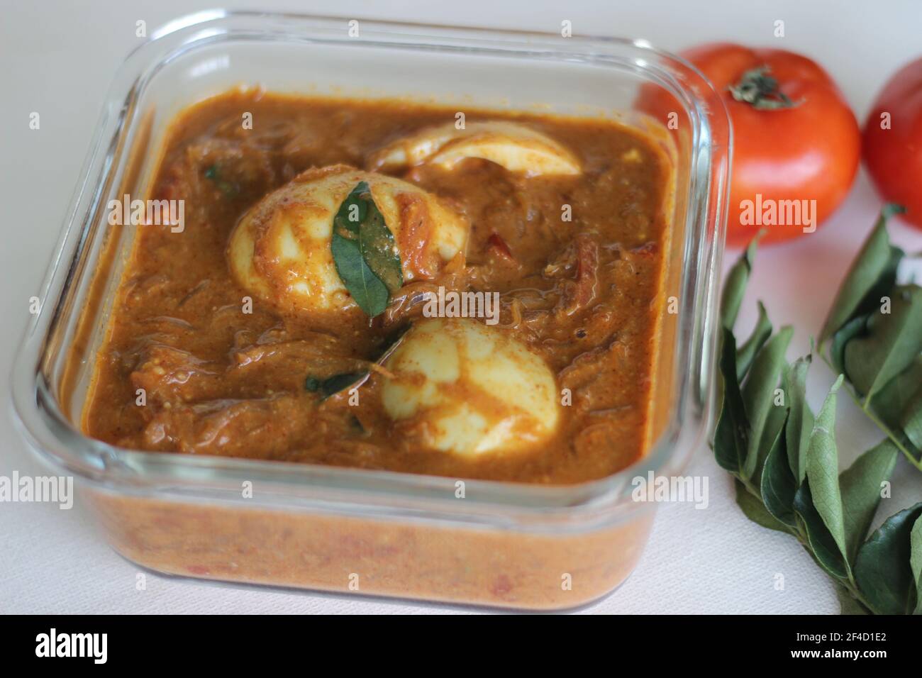 Egg curry. Boiled eggs in a cashew tomato based gravy. Shot on white